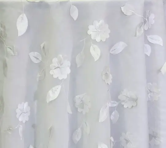 White dimensional floral print tablecloth.