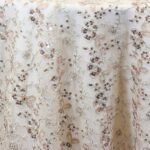 Sheer ivory, silver, and rose sequin floral print tablecloth.