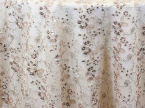 Sheer ivory, silver, and rose sequin floral print tablecloth.